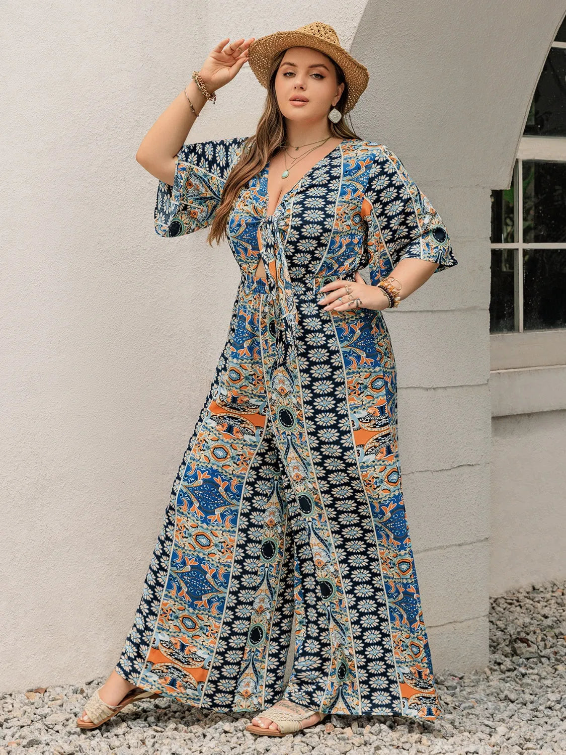 Plus Size Printed Half Sleeve Wide Leg Jumpsuit - Wellen Fashion